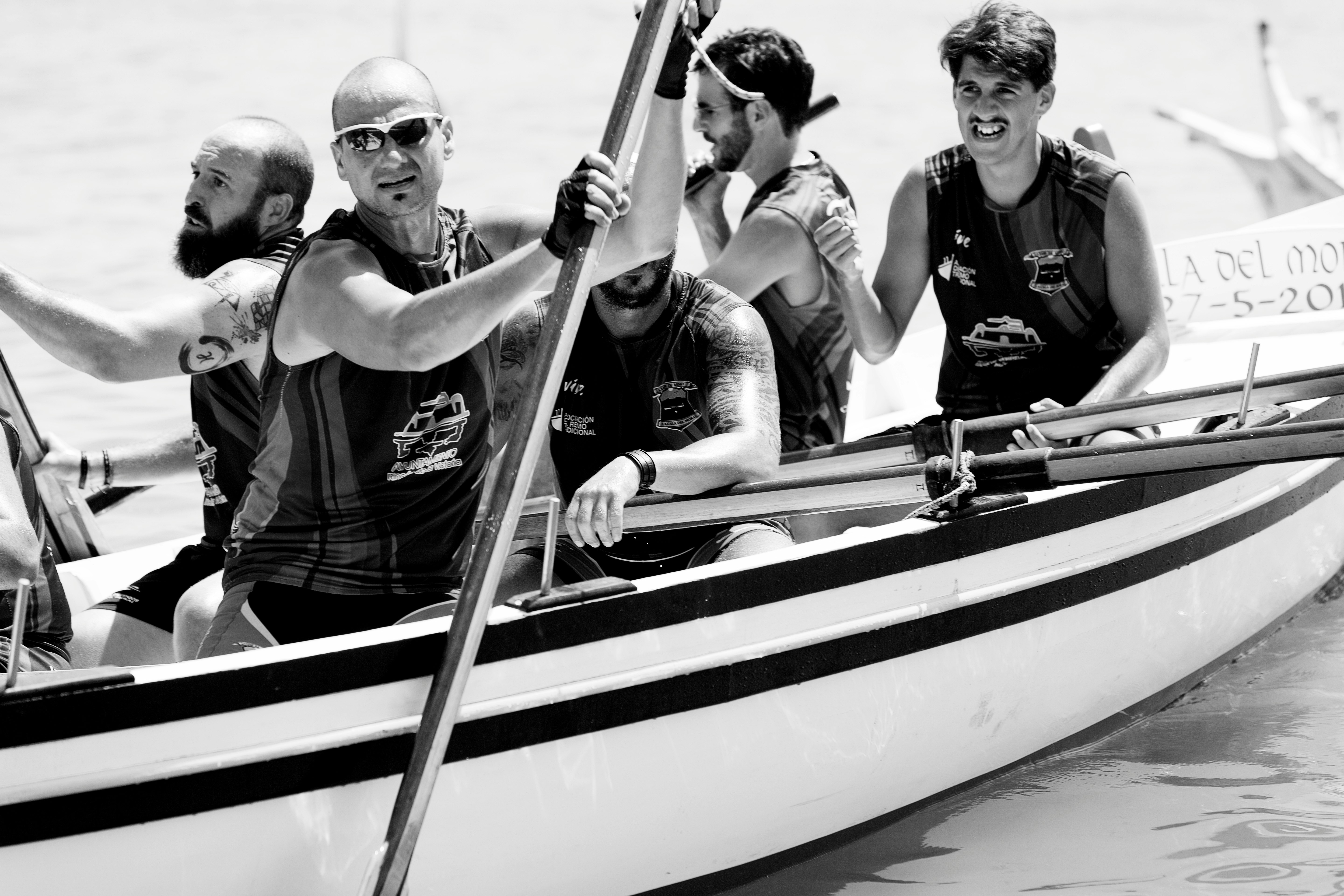 group of men riding boat